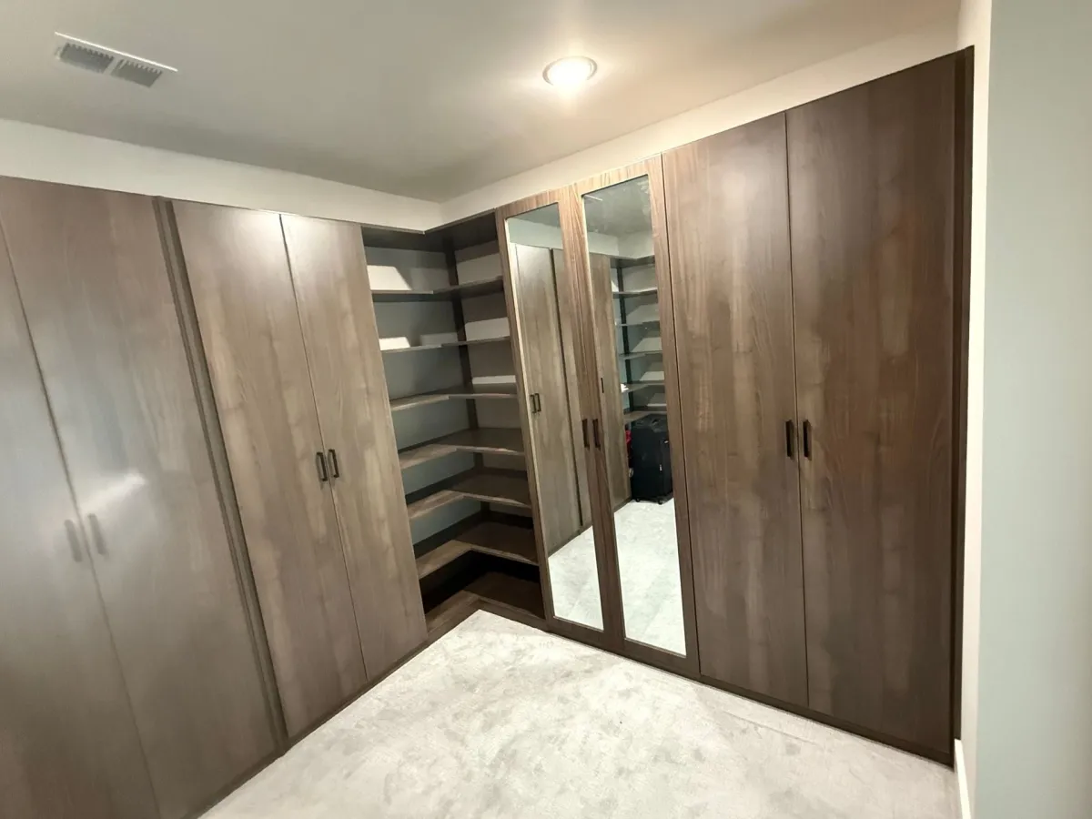 Custom home office built-in with shelving and cabinetry by Pi Cabinetry